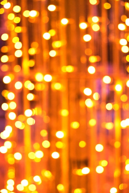 Abstract background of bright orange glowing Christmas garlands.