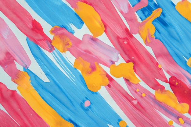 Abstract background brush strips blue, pink, yellow and drops