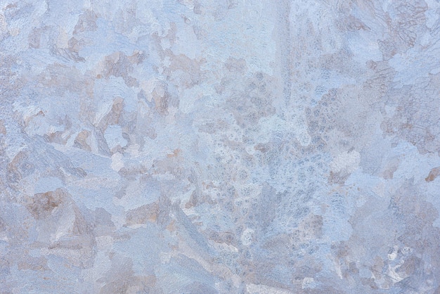 Abstract background created by the nature of the pattern of ice on the glass