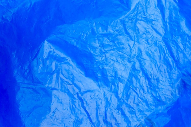 추상적 인 배경 구겨진 플라스틱 필름 질감 파란색 쓰레기 봉투