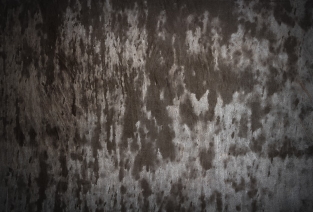 Abstract background of dark wet concrete wall texture.