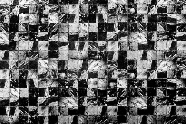 Abstract background from dark marble pattern on wall.