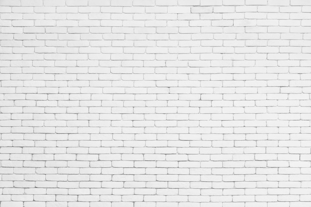 사진 흰색 벽돌 패턴 벽에서 추상 배경입니다. 빈티지 배경 벽돌 질감 표면입니다.