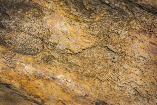 Abstract background from yellow stone wall