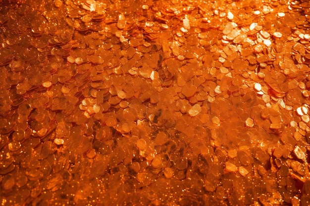 Abstract background of golden glitter confetti on the water surface