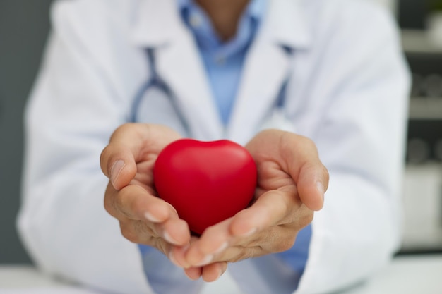 abstract background of hands holding heart model