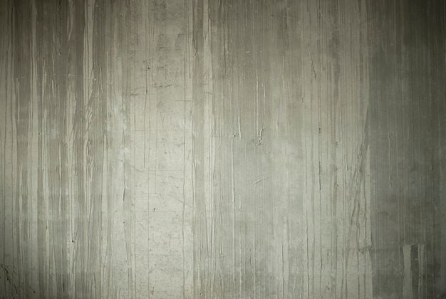 The abstract background is the texture of a concrete gray wall