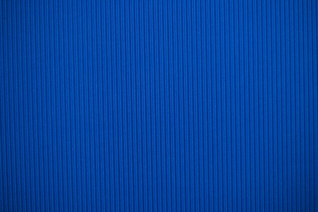 Abstract background made of corrugated paper for blue application Space for text Texture Vertical stripes