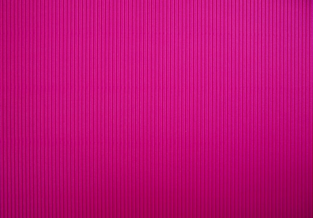 Abstract background made of corrugated paper for pink application Space for text Texture Vertical stripes