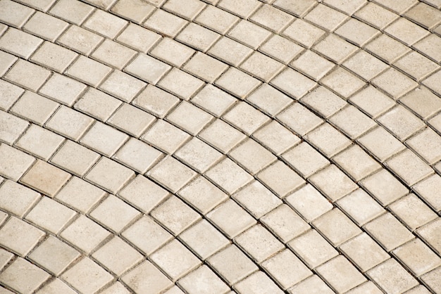 Abstract background of old cobblestone pavement close-up