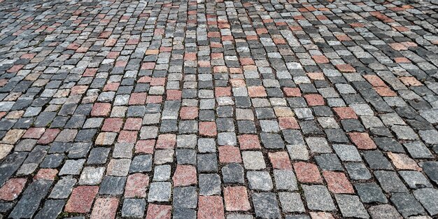 Photo abstract background of paving stones street paving cobblestone pavement