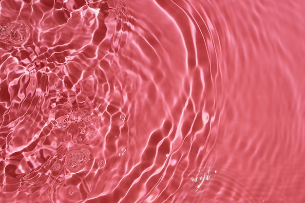 Sfondo astratto di acqua rosa increspata