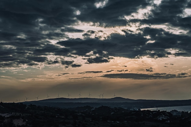 Abstract background sky Dawn Sunset Contrast dark shadow bright cloud sun orange silhouette above the mountains near the sea