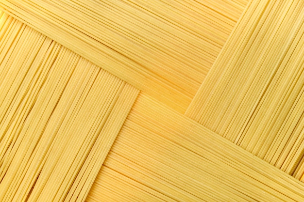 The abstract background texture of pasta closeup spaghetti