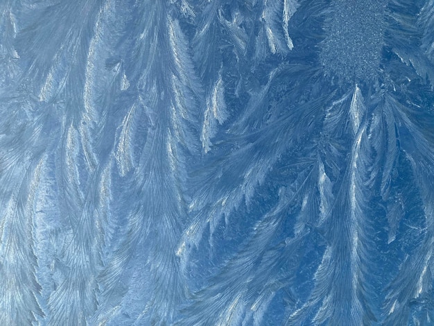 Photo abstract background texture pattern of ice on windscreen glass after heavy frost