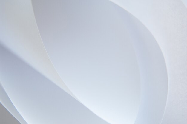 Abstract background of a twisted sheet of white paper