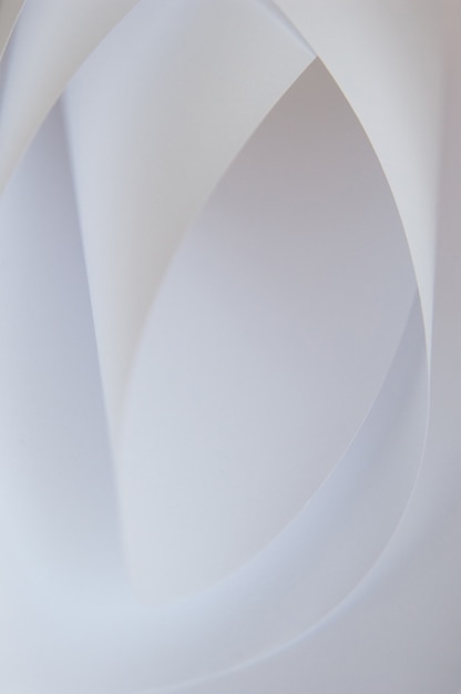 Abstract background of a twisted sheet of white paper