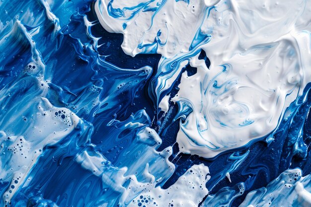 Abstract background of vivid blue and white color mixing with different tints creating uneven surfac