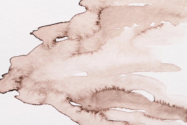 Abstract background watercolor paint stains on white paper brown ink