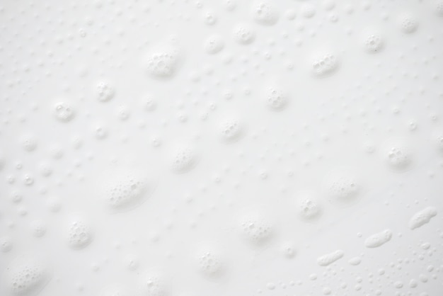 Abstract background white soapy foam texture. Shampoo foam with bubbles