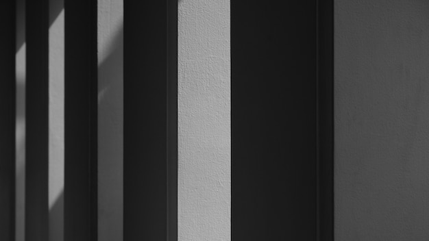 Abstract background of a white wall with shadows from the window. - monochrome