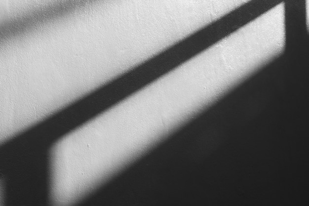 Photo abstract background of a white wall with shadows from the window.