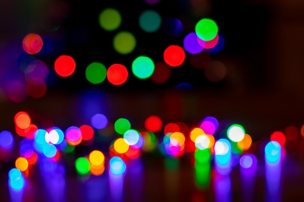 Abstract background with colorful sparkling bokeh on a dark background Holiday concept