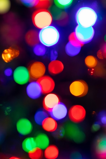 Abstract background with colorful sparkling bokeh on a dark background Holiday concept