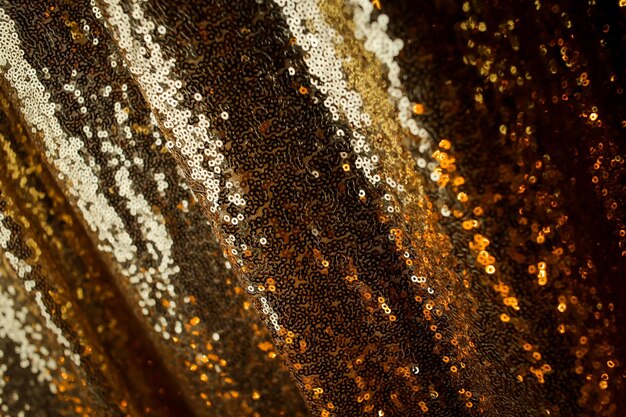 Abstract background with gold sequins color on the fabric Background sequin gold sequin BACKGROUND