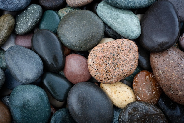 Abstract background with round wet pebble stones