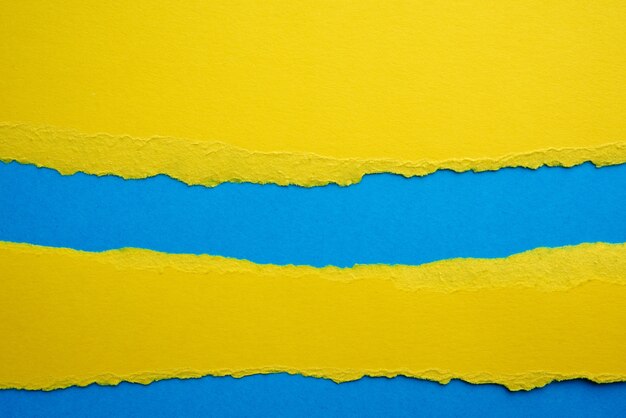 Abstract background with torn edges of yellow paper