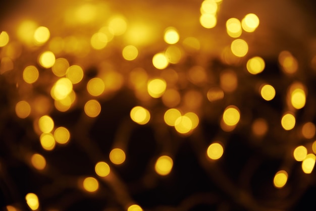 Abstract background with yellow defocused lights with bokeh at night