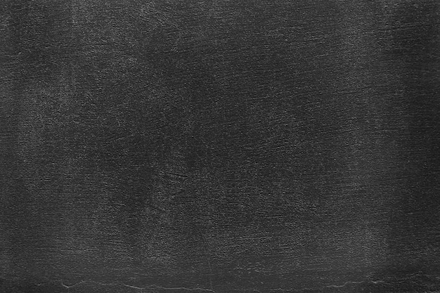 Абстрактный черный фон. Черная штукатурка текстуры. Темная шероховатая поверхность.