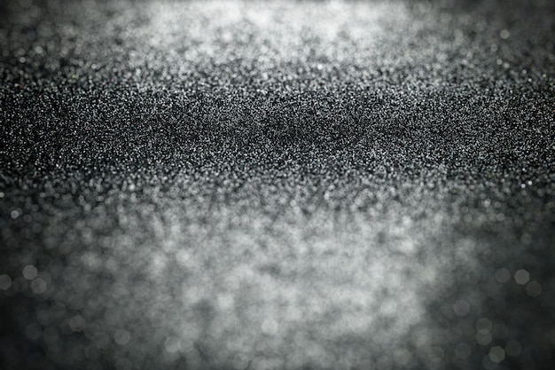Photo abstract black glitter background, textures with out of focus area