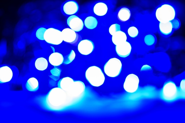 Abstract blue Christmas lights, bokeh as background.