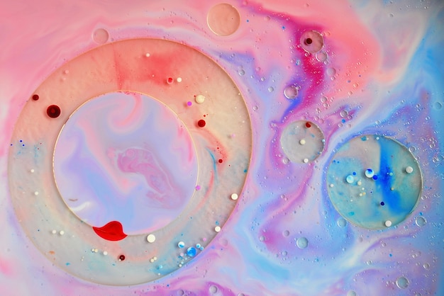 Abstract. Blue, pink, red colors of oil and liquid. Psychedelic background