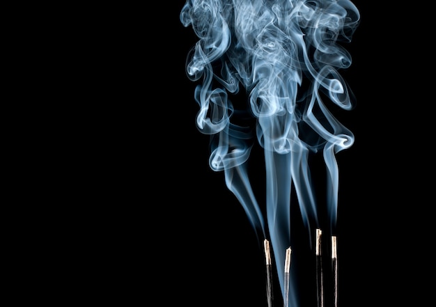 Abstract blue smoke waves from aroma sticks