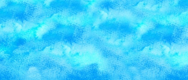 Abstract blue watercolor background. The color splashing on the paper. Hand drawn.