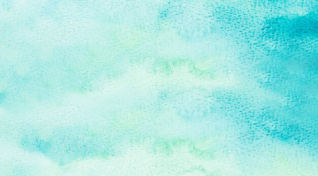 Abstract blue watercolor background. The color splashing on the paper. Hand drawn.