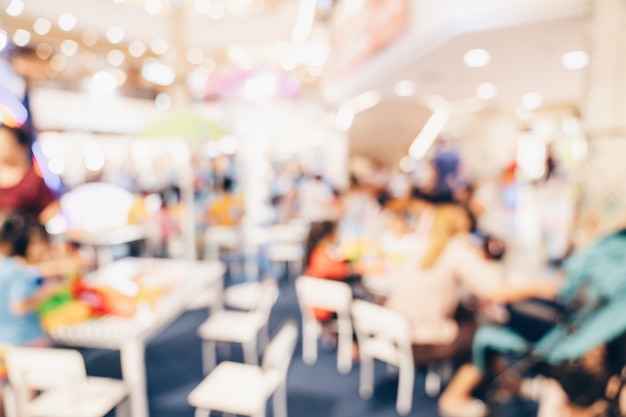 Abstract blur background crowd people in shopping mall for background, Vintage toned.