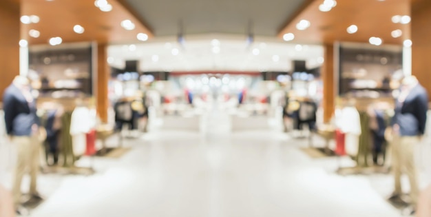 Sfuocatura astratta boutique di abbigliamento display interno dello sfondo del centro commerciale