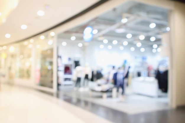 Abstract blur clothing boutique display interior of shopping mall background