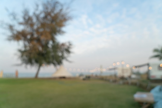 abstract blur and defocused camping yard on beach for background