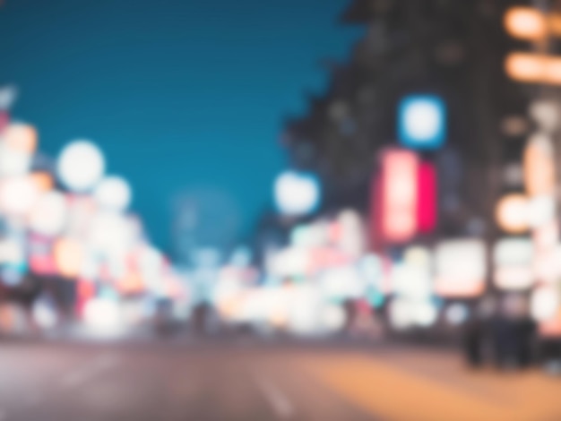 Abstract blur and defocused night street with bokeh for background usage Vintage tone