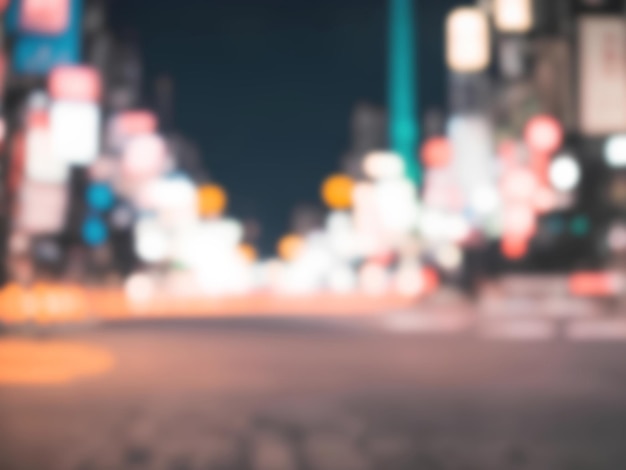 Abstract blur and defocused night street with bokeh for background usage Vintage tone