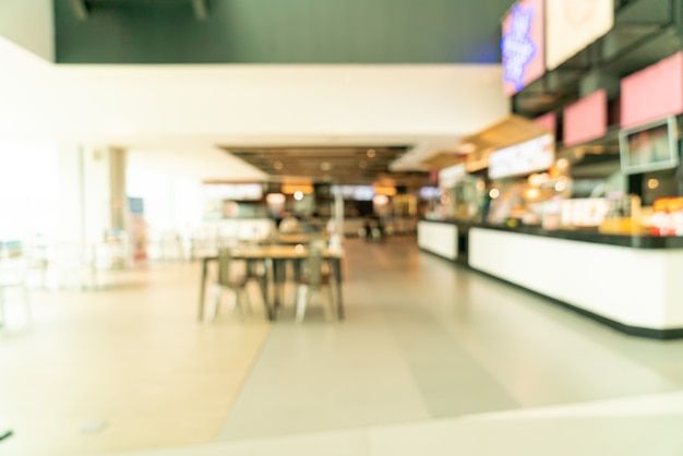 abstract blur food court in shopping mall for background