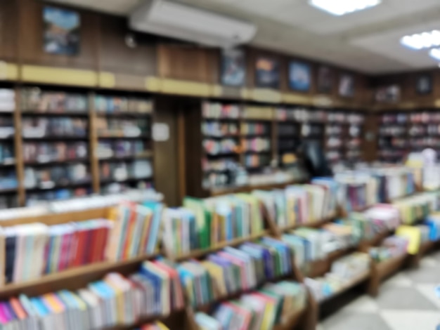 Abstract blur front book store defocused for background usage Stack of book and bookshelf in book store