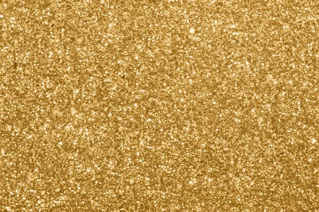 Photo abstract blur gold glitter sparkle defocused bokeh light background