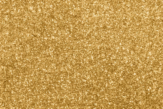 Photo abstract blur gold glitter sparkle defocused bokeh light background