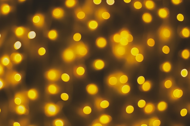 Abstract blur golden bokeh light Christmas holiday background